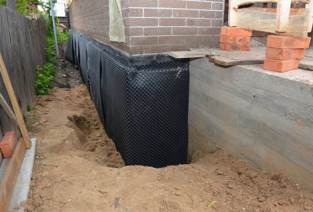 SJ Waterproofing Pros technician performing targeted Exterior Waterproofing assessment in Pleasant Hill, TN